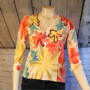 Ladies 3/4 sleeve floral sweater with Rick rack embroidery on it
